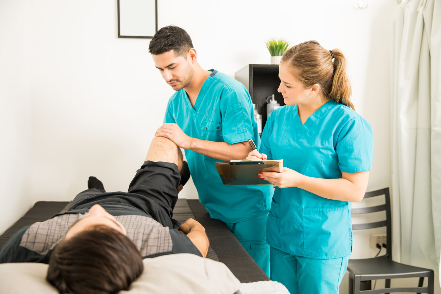 Physiotherapist examining the patients